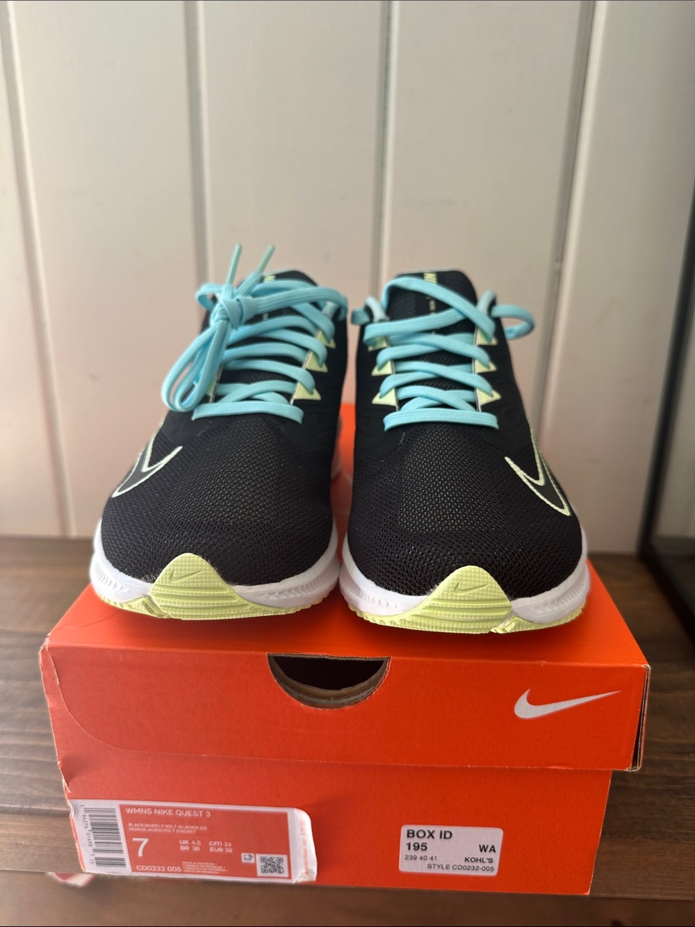Nike Women’s Black Sneakers with Light Blue Laces and Pale Yellow Accents